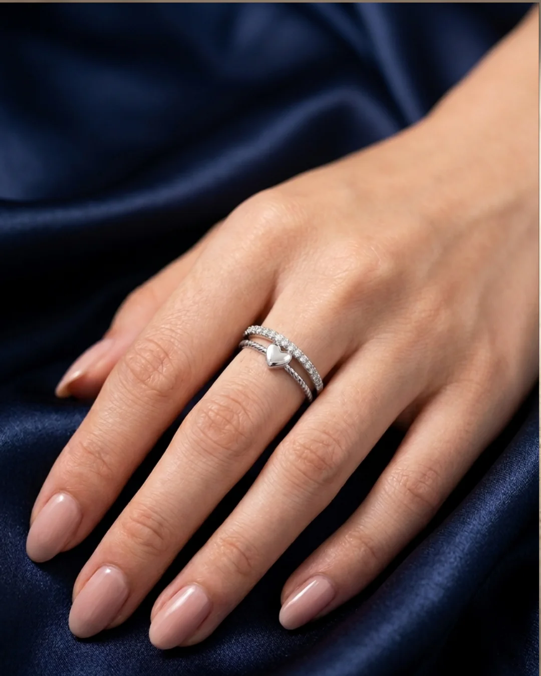 silver-plated adjustable ring with a heart charm and cubic zirconia stones